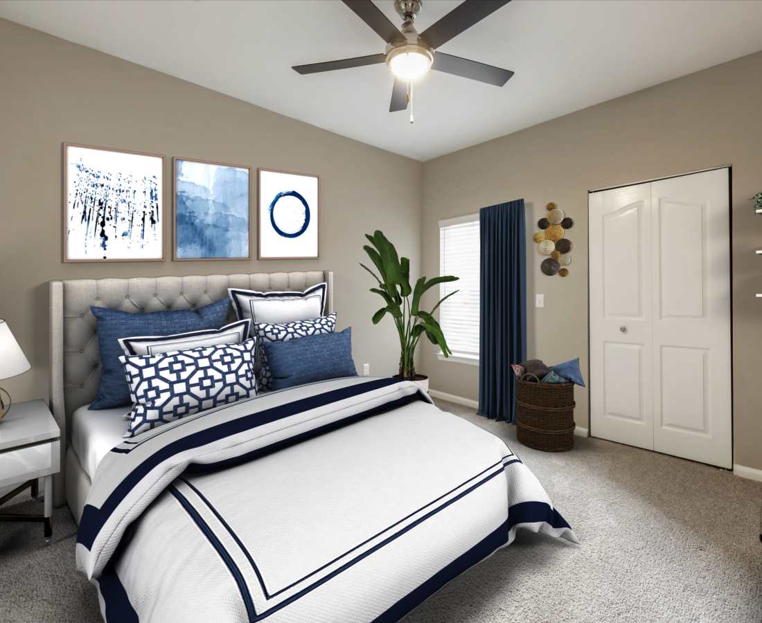  Bright bedroom with a large bed and ceiling fan at The Legends At ChampionsGate in ChampionsGate, Florida 
