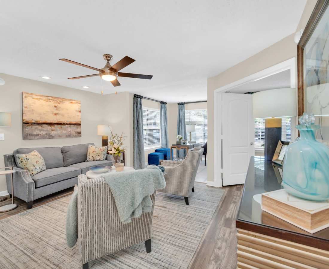 Living room with wood-style flooring at The Summit At Metrowest in Orlando, Florida