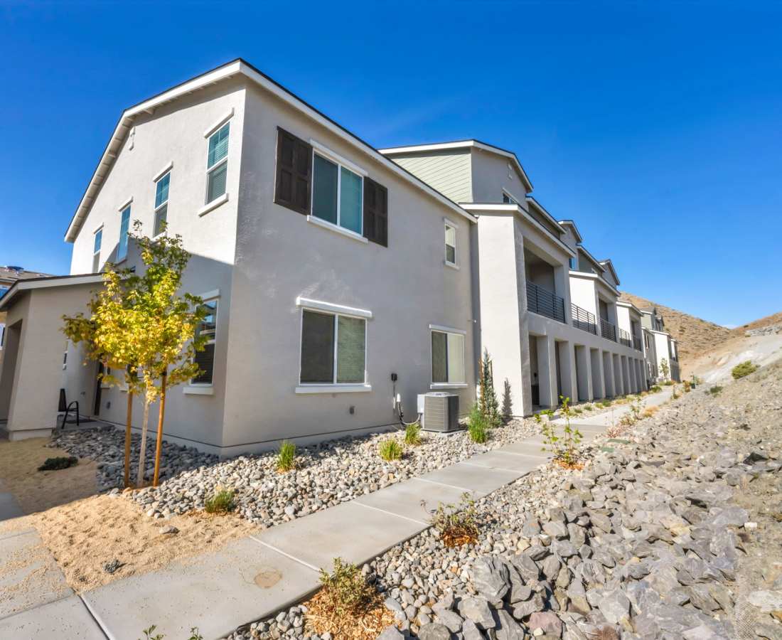 A house featuring a driveway and a gravel path leading to the entrance at Prosper 83 in Sparks, Nevada