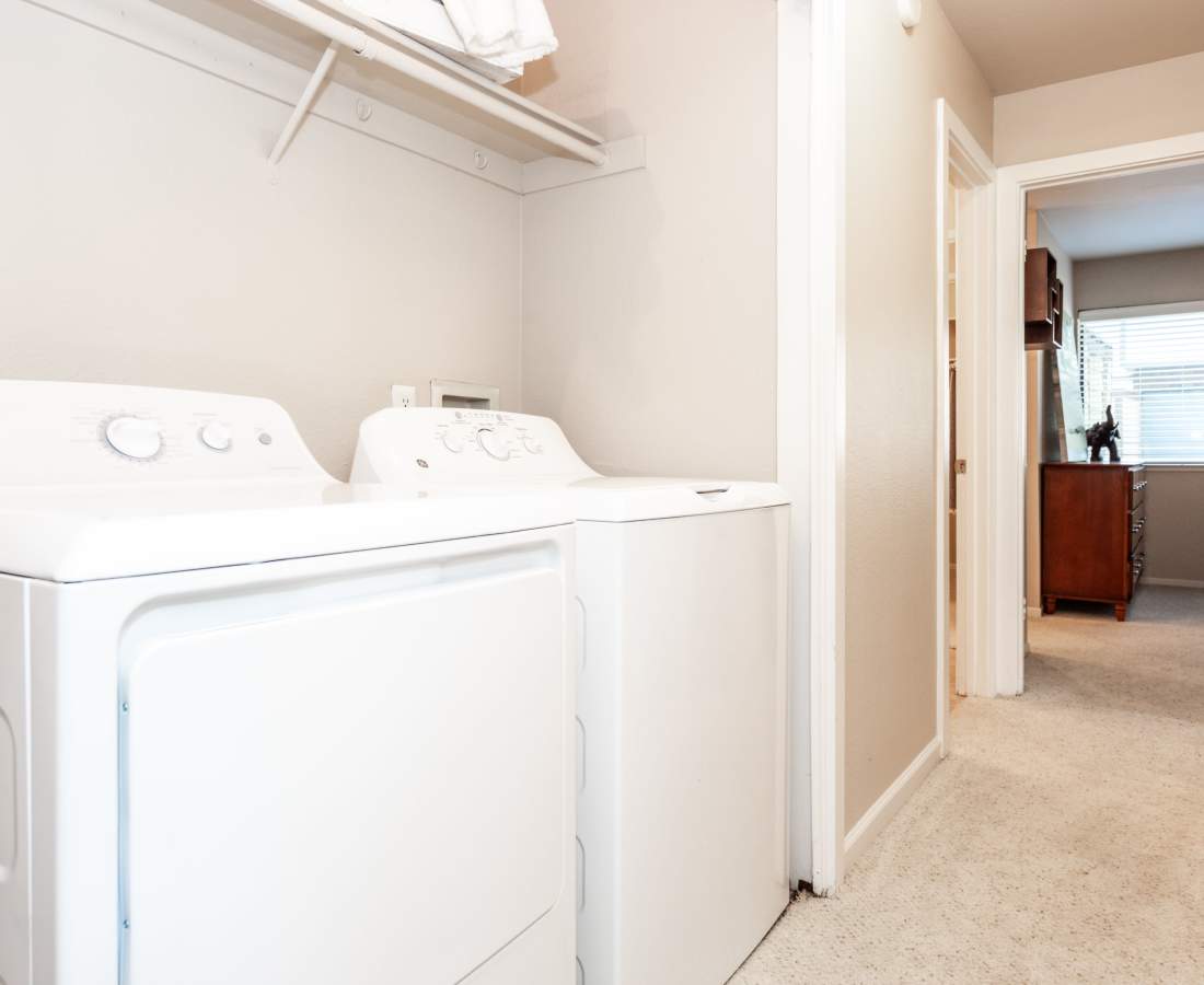 In-unit washer and dryer with extra linen storage at Hidden Creek in Vacaville, California