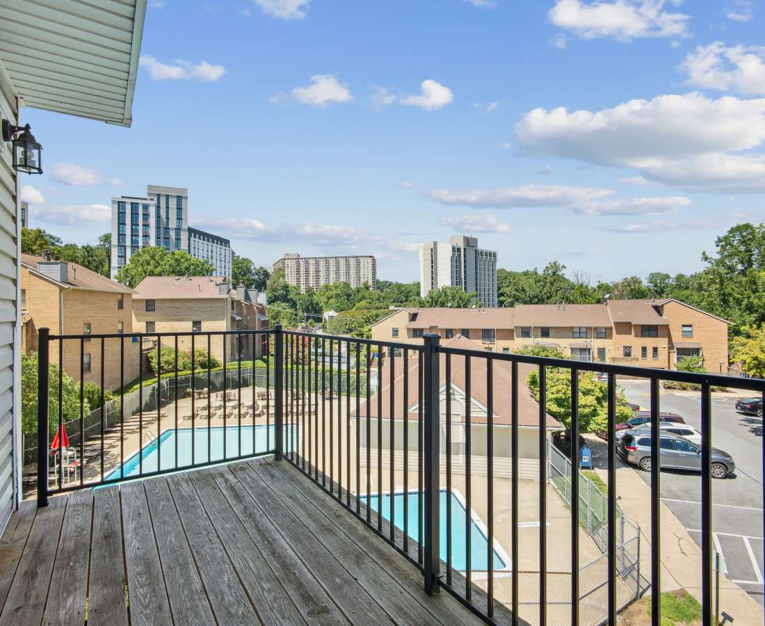 Balcony railing overlooking a pool area at Bethesda Hill in Bethesda, Maryland