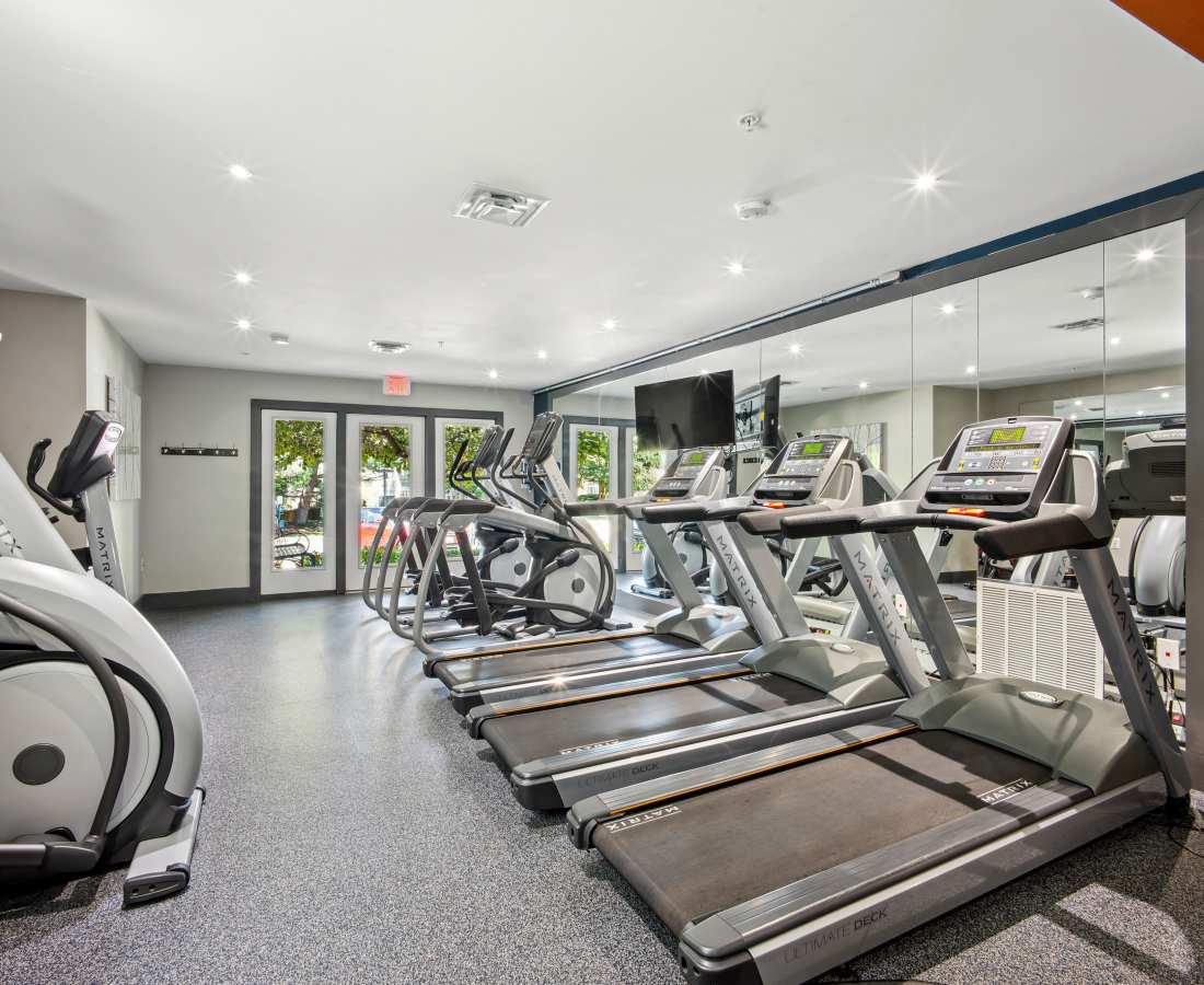 Treadmills lined up in a fitness room at Bethesda Hill in Bethesda, Maryland