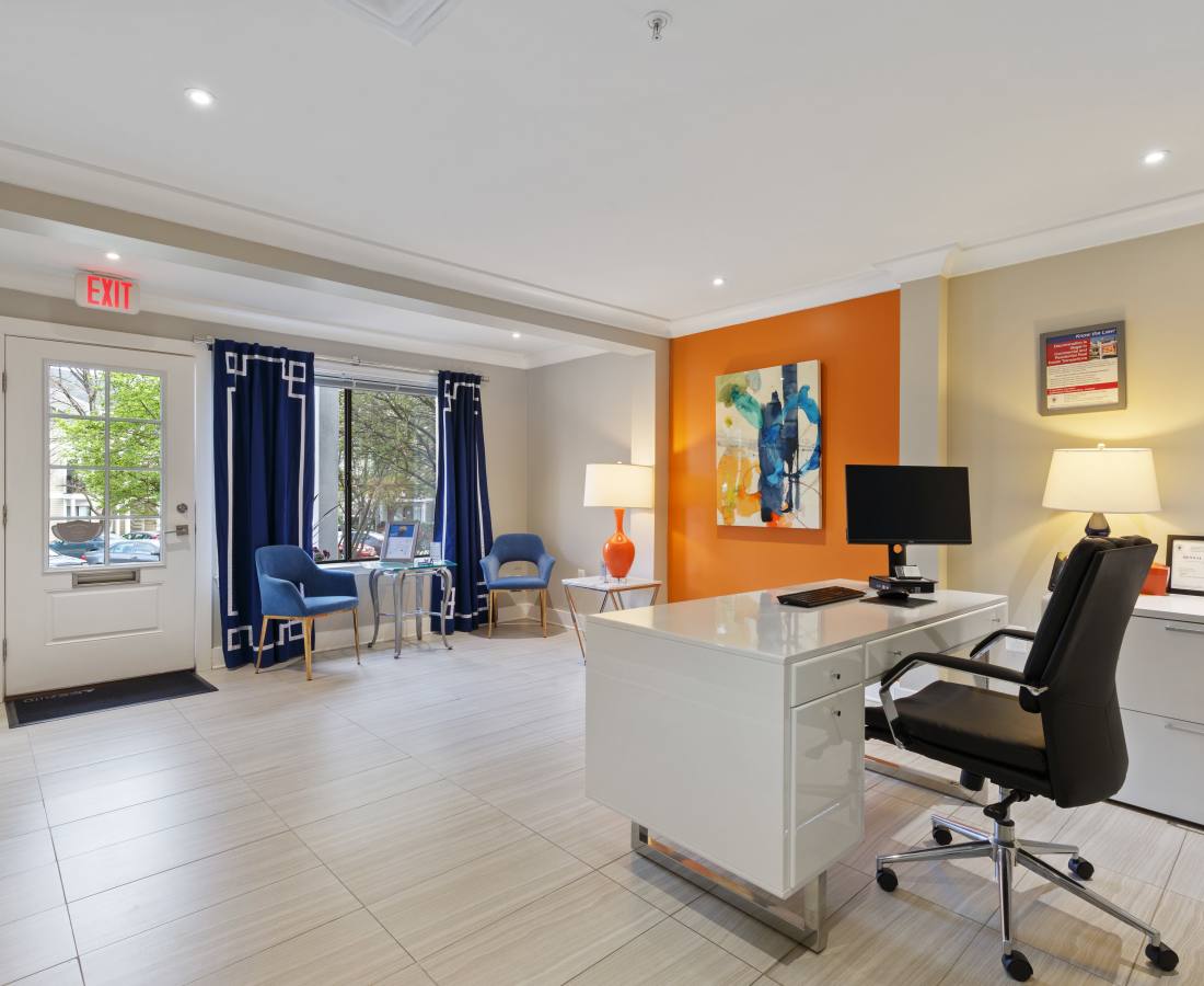 Large window with blue curtains and greenery at Bethesda Hill in Bethesda, Maryland