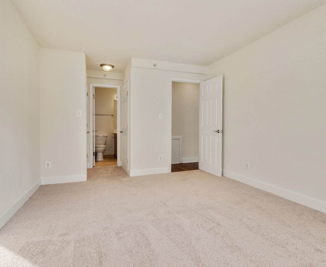 Carpeted room with two doorways at Bethesda Hill in Bethesda, Maryland