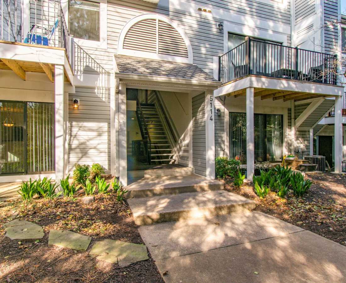 Steps lead to an entrance with greenery at Bethesda Hill in Bethesda, Maryland