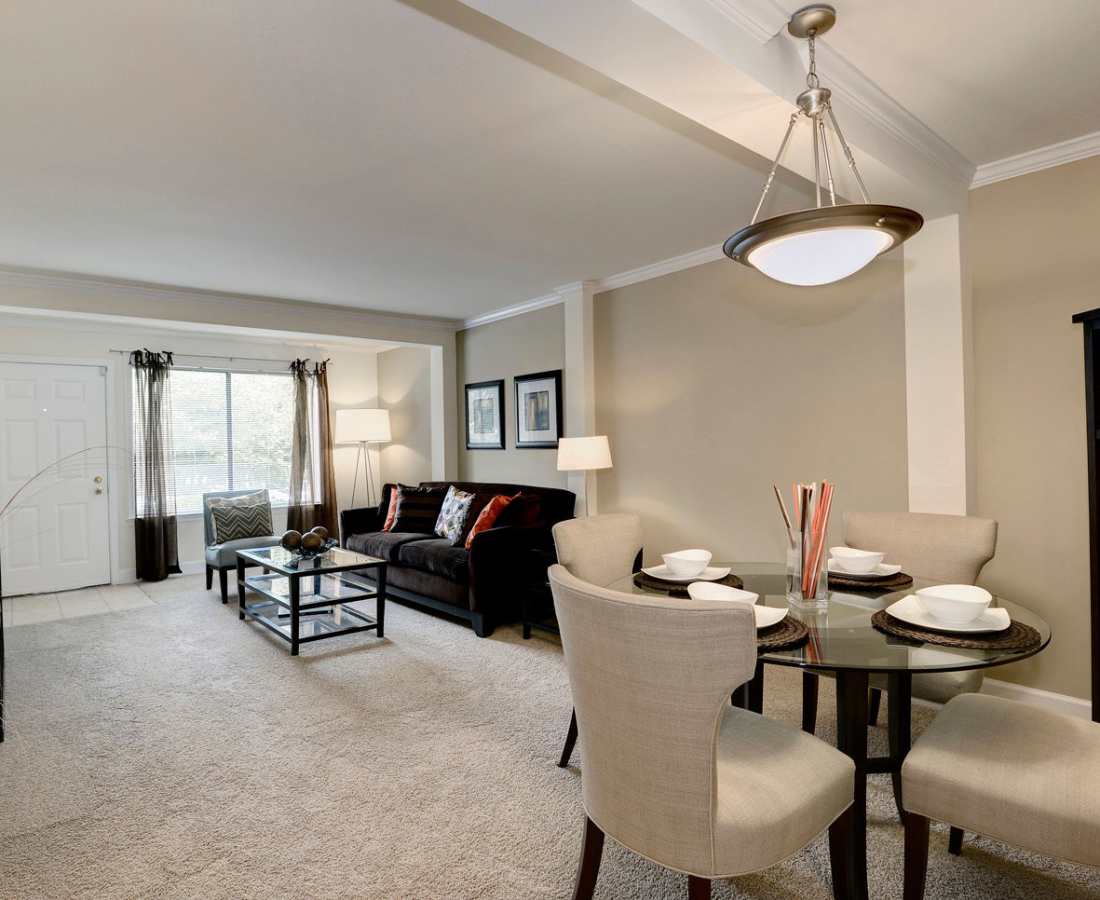 Glass dining table with four chairs at Bethesda Hill in Bethesda, Maryland