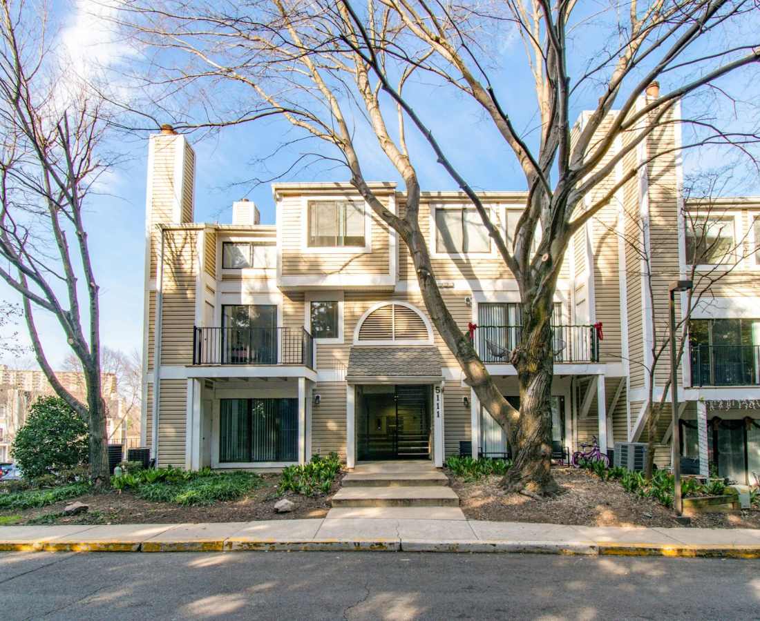 Apartment building with trees and landscaping at Bethesda Hill in Bethesda, Maryland