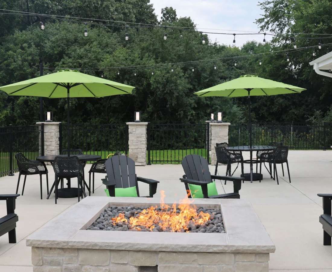 Community outdoor seating with firepit at Pritchard Park Place in Racine, Wisconsin