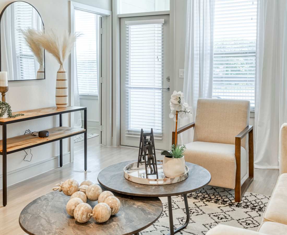Coffee table with decorative items at Dakota at Shepherd in Houston, Texas