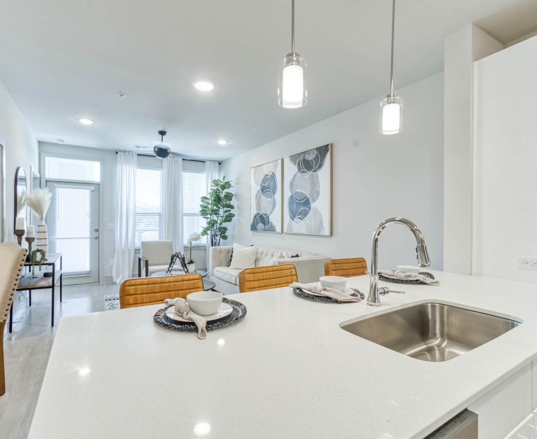 White countertop with sink and dishes at Dakota at Shepherd in Houston, Texas