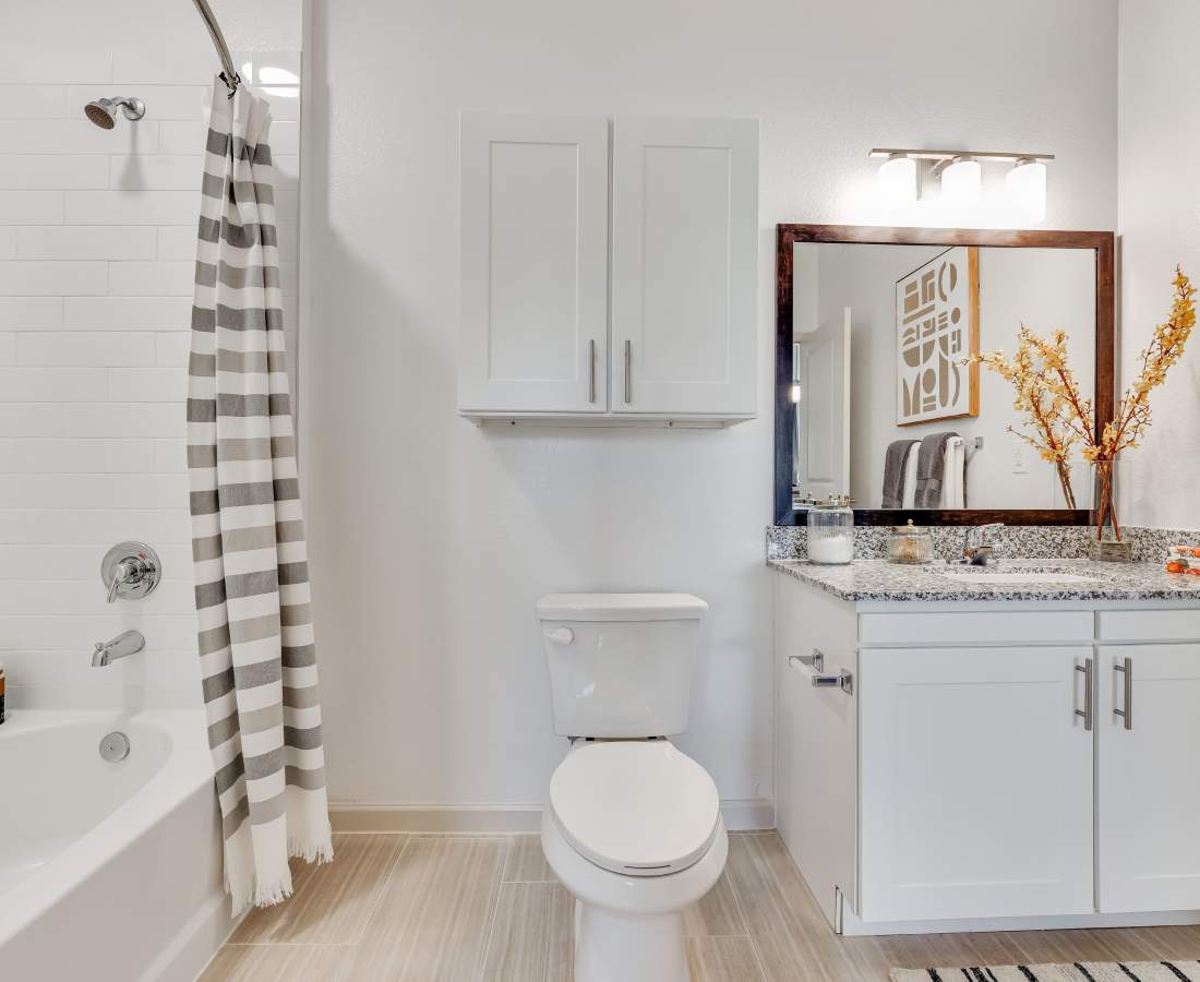 Modern bathroom with granite countertops at Meridian City Park in Houston, Texas