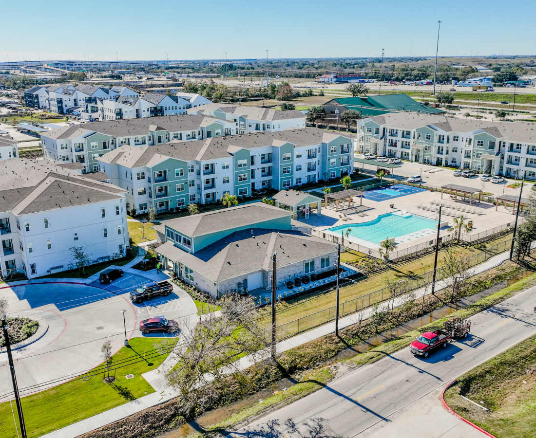 Aerial view of apartment community with pool at Meridian City Park in Houston, Texas