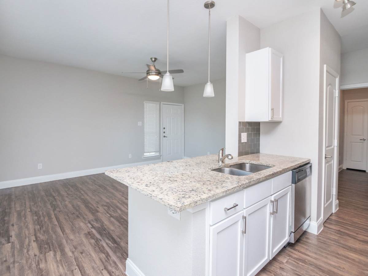 Water sink with wood flooring at Green Tree Place in Houston. TX
