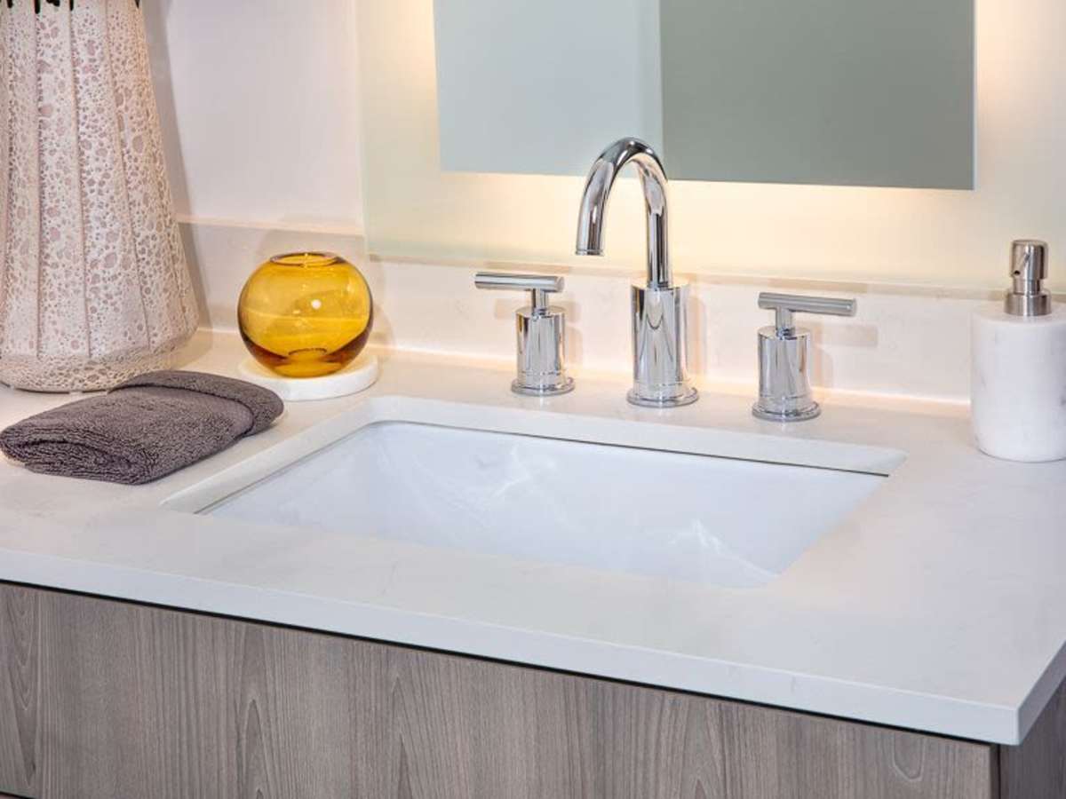 Modern lighting and finishes in an apartment bathroom at J Linea in Washington, District of Columbia