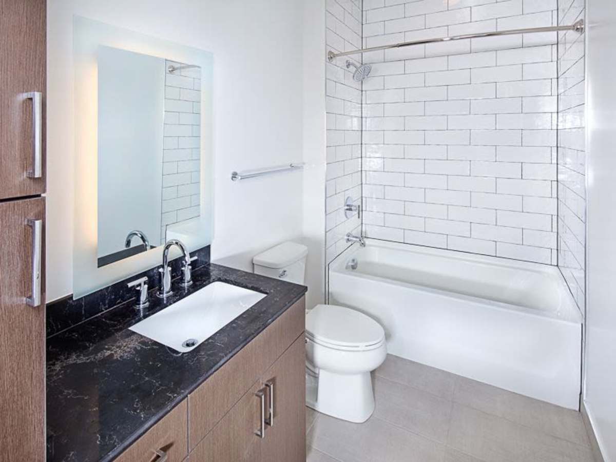 Bathroom with a shower and tub at J Linea in Washington, District of Columbia