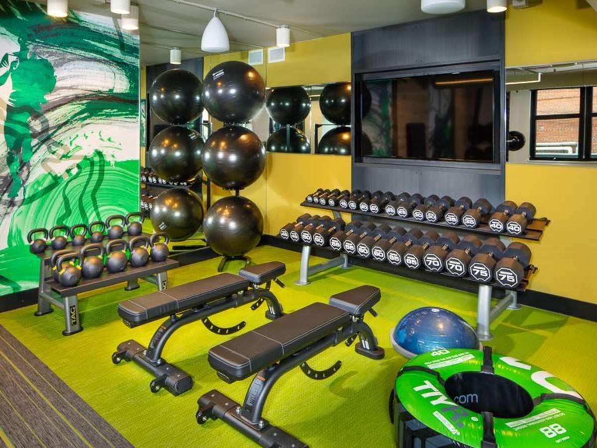 Fitness center with dumbbells at J Linea in Washington, District of Columbia