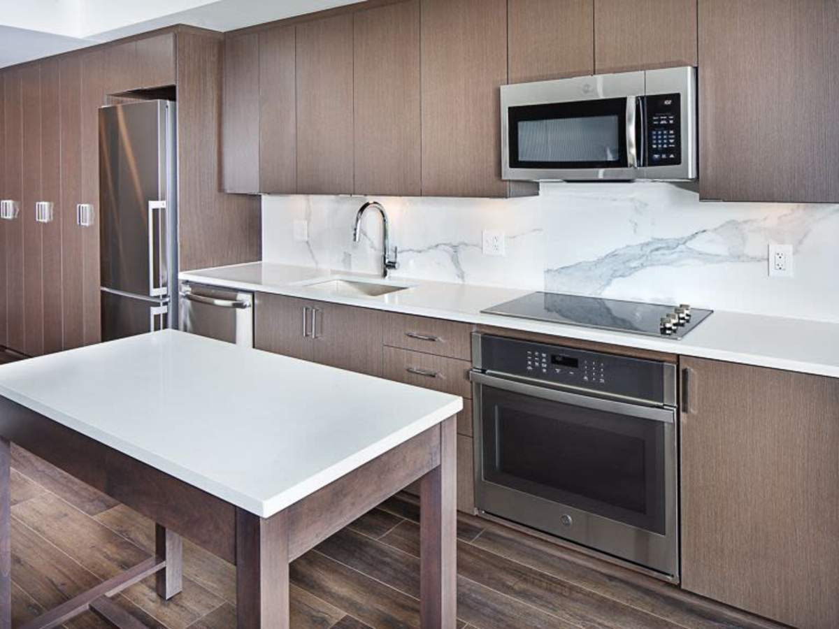 Kitchen island in an apartment with stainless-steel appliances at J Linea in Washington, District of Columbia