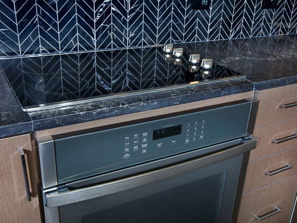 Chevron tile backsplash in a kitchen at J Linea in Washington, District of Columbia