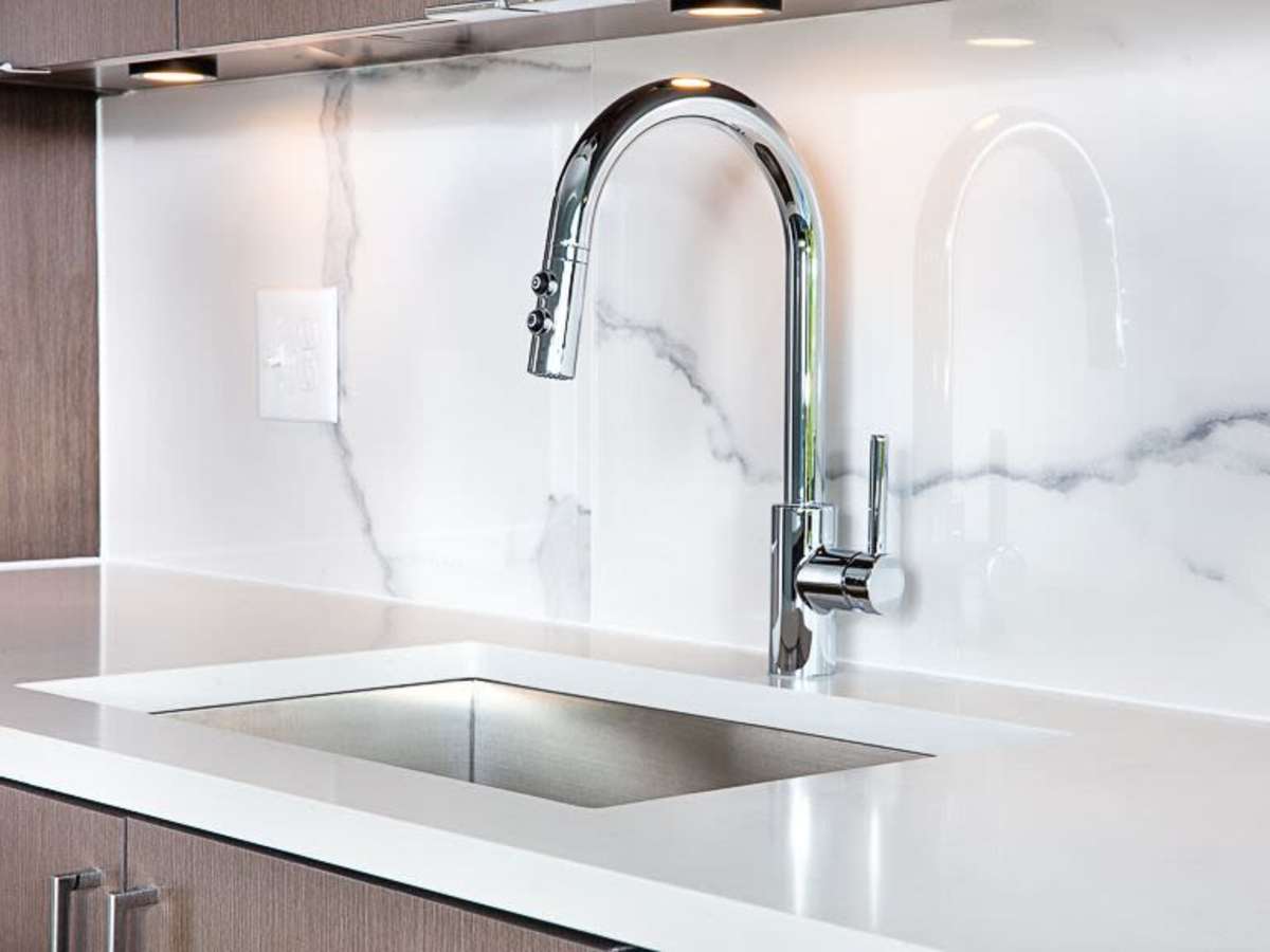 Modern finishes in an apartment kitchen with stainless-steel appliances at J Linea in Washington, District of Columbia