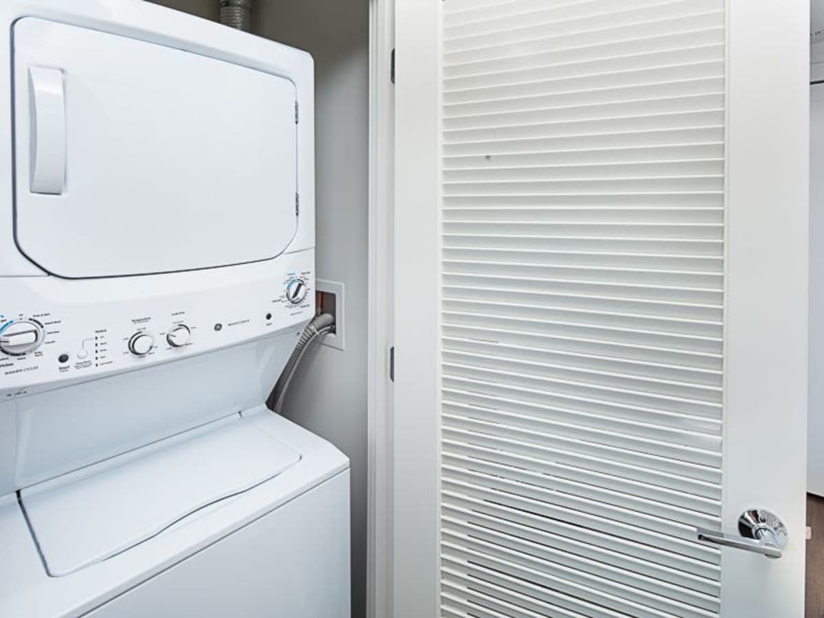 Apartment with a stacked washer and dryer at J Linea in Washington, District of Columbia