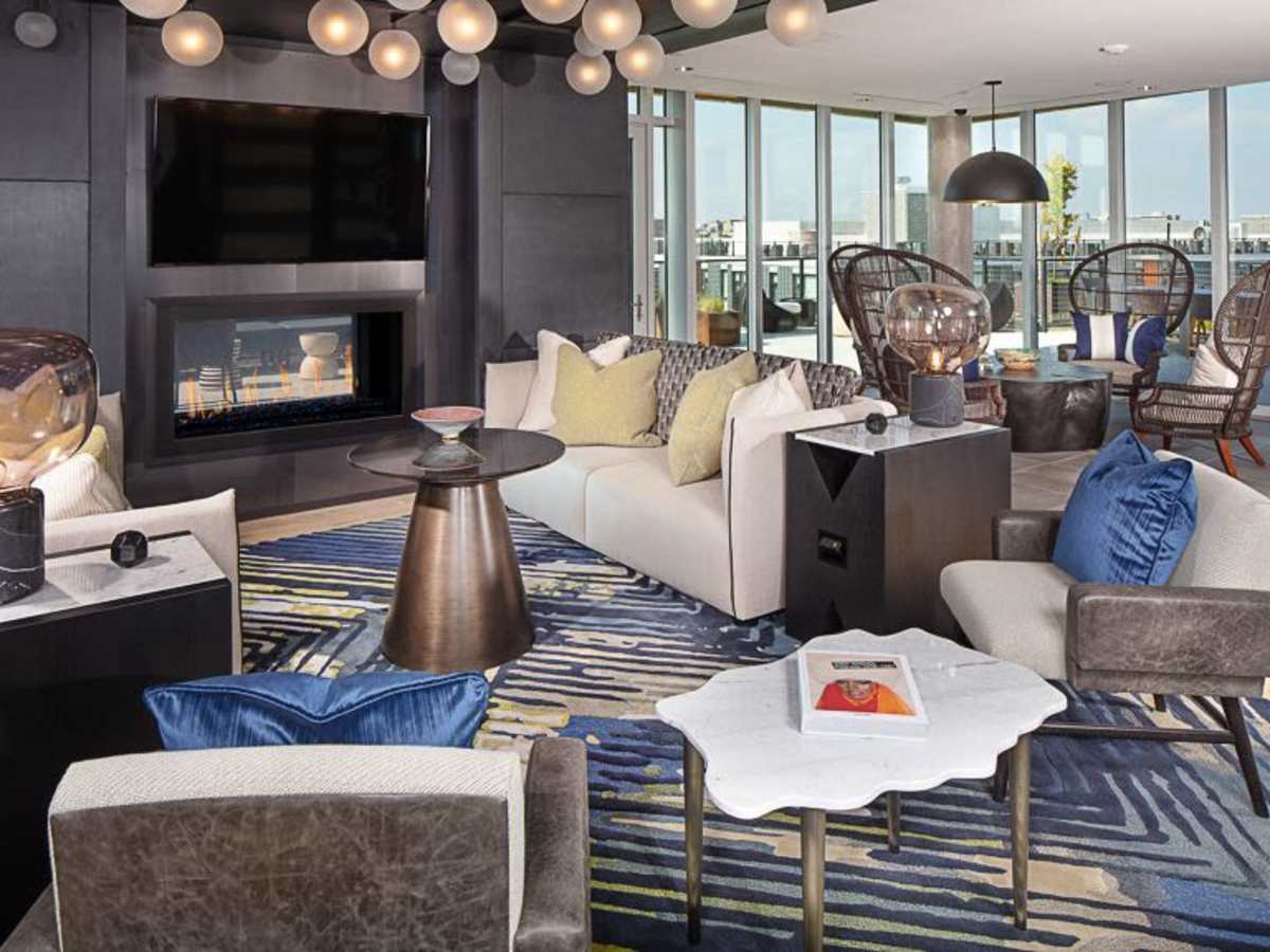 Fireplace and seating area in the clubhouse at J Linea in Washington, District of Columbia