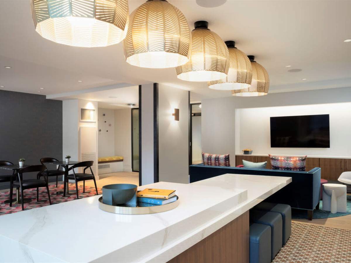 TV and clubhouse kitchen area at J Vue at The LMA in Boston, Massachusetts