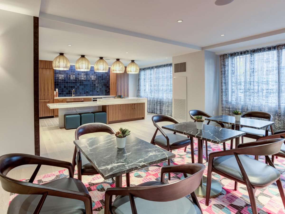 Tables and chairs in the clubhouse kitchen at J Vue at The LMA in Boston, Massachusetts