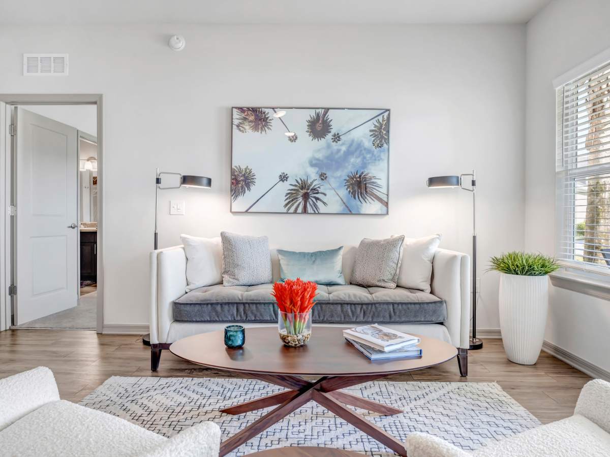 Cozy couch in living area at The Carlton of Fort Myers in Fort Myers, Florida