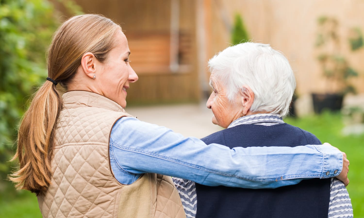 Caregiver helping a senior woman at Sandpiper Rehab/Nursing in Mt. Pleasant, South Carolina
