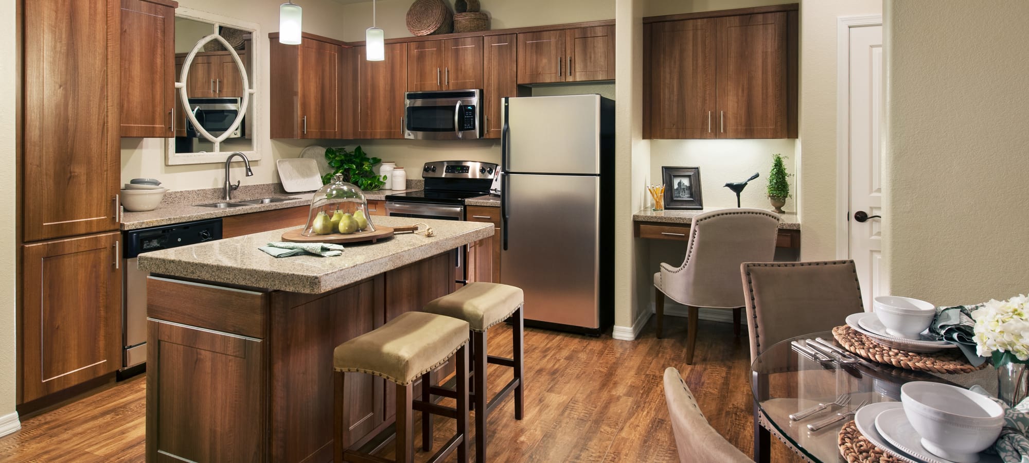 Custom cabinetry and stainless-steel appliances in model home's kitchen at San Paseo in Phoenix, Arizona