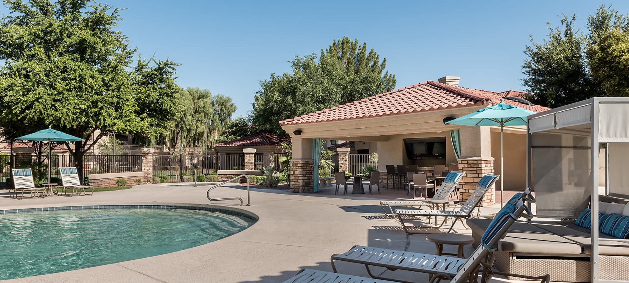 Beach-style swimming pool at San Cervantes in Chandler, Arizona
