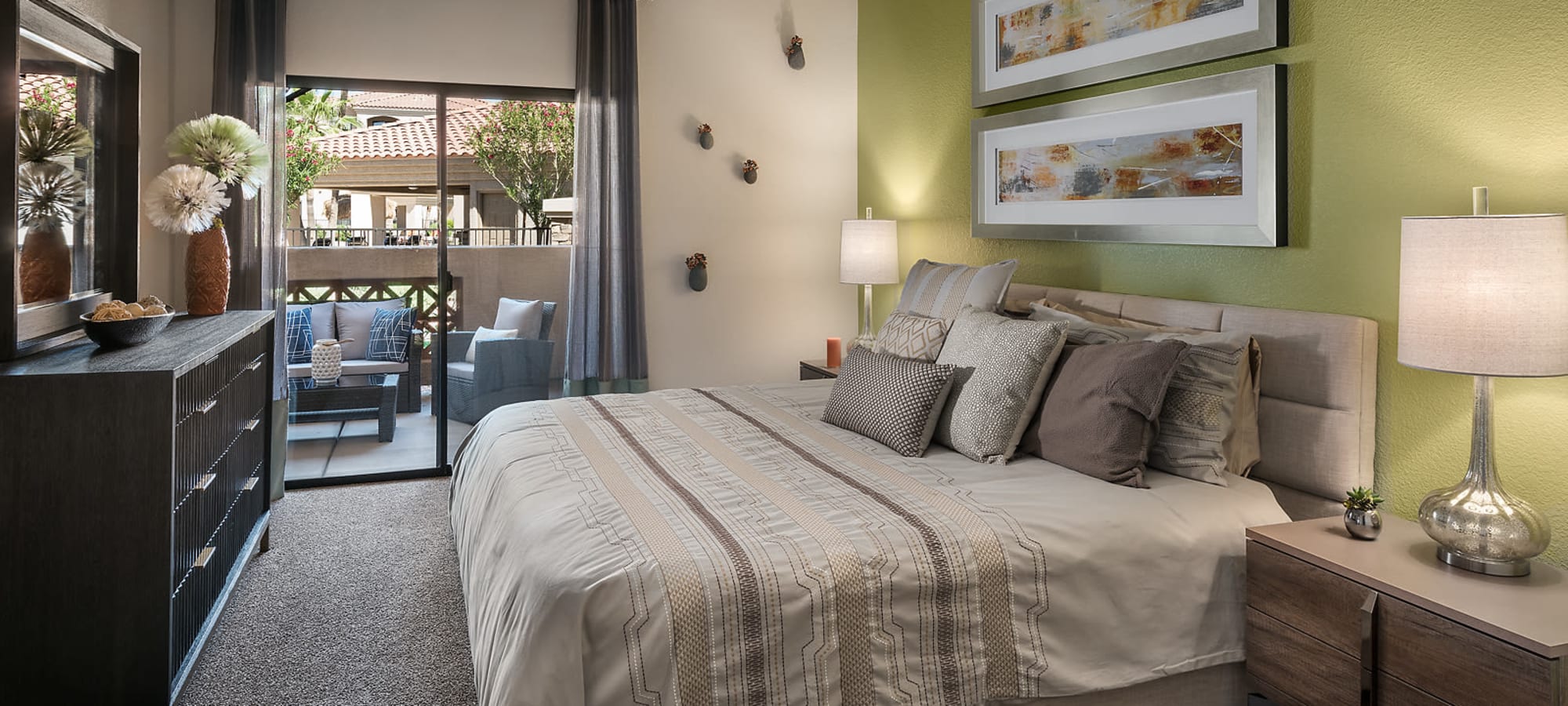 Master bedroom with patio access in a model home at San Pedregal in Phoenix, Arizona