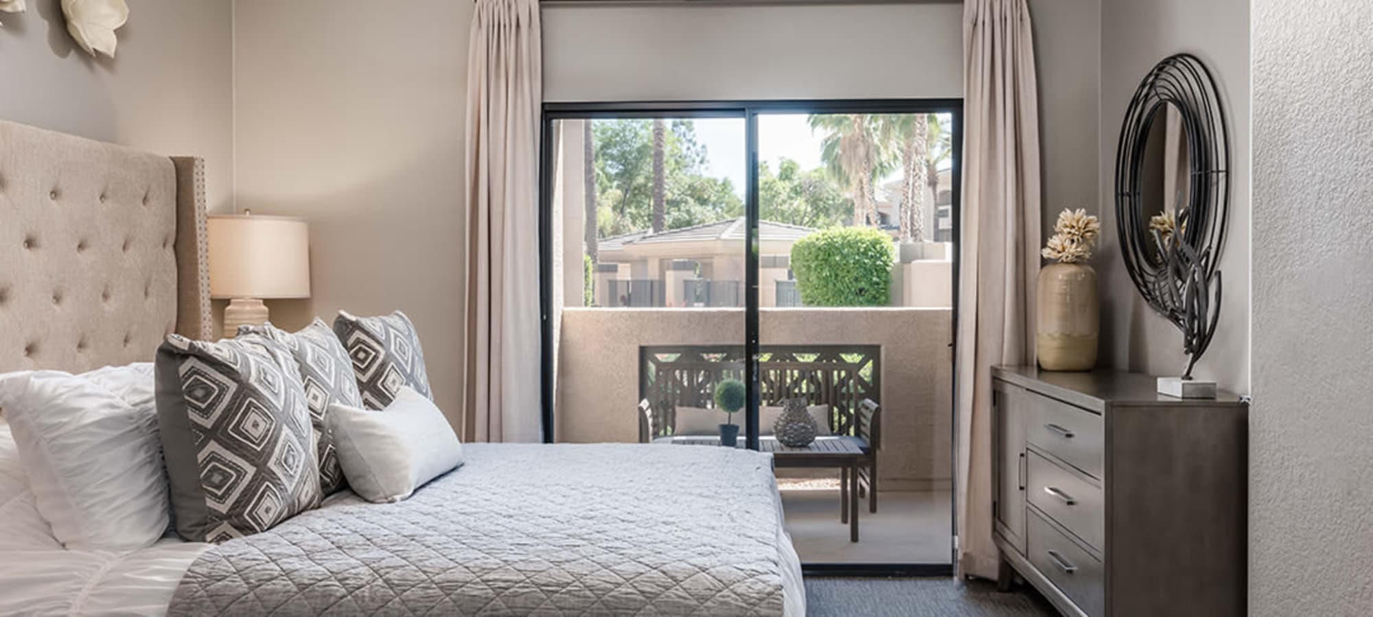Tons of natural light with the floor to ceiling windows in the bedroom at Ascend at Kierland in Scottsdale, Arizona