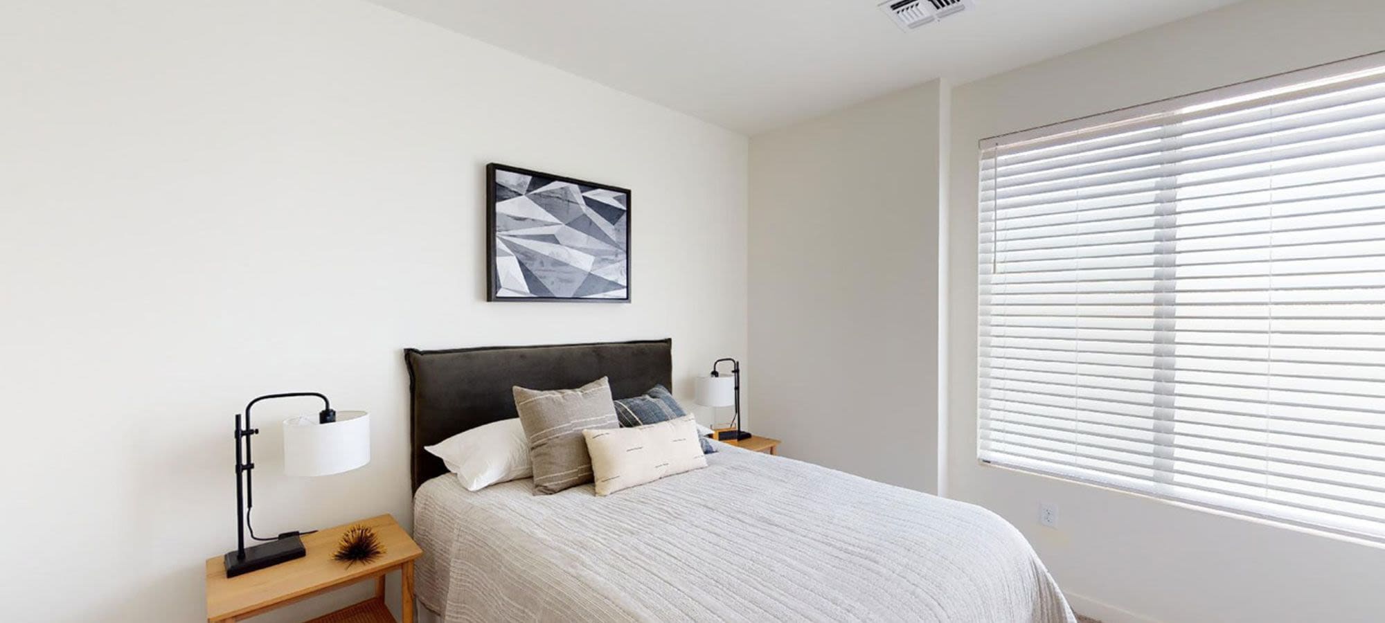 Model apartment bedroom featuring natural light at Novella at Biltmore in Phoenix, Arizona