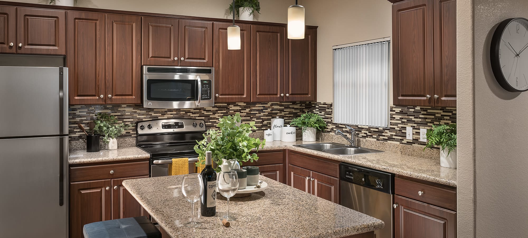 Luxury kitchen with stainless steel appliances at San Norterra in Phoenix, Arizona