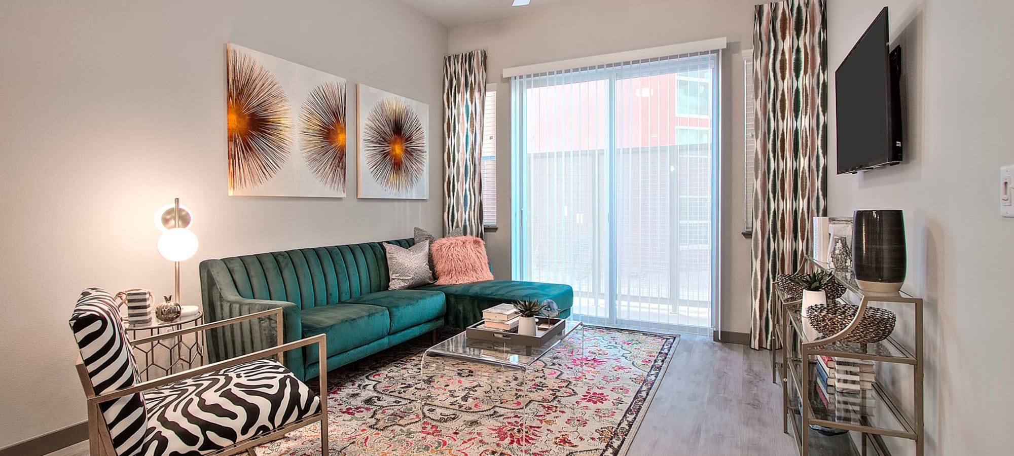 Well-furnished living area in a model apartment at Jade Apartments in Las Vegas, Nevada