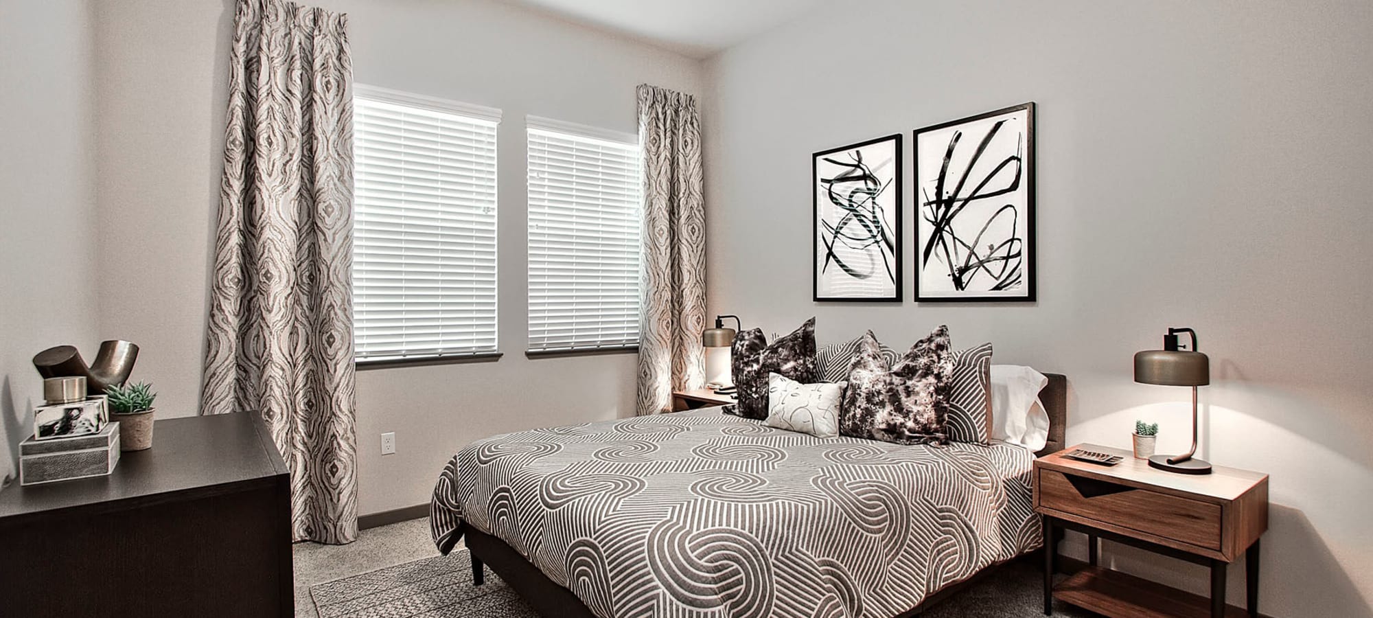 Classically furnished primary suite in a model home at Jade Apartments in Las Vegas, Nevada