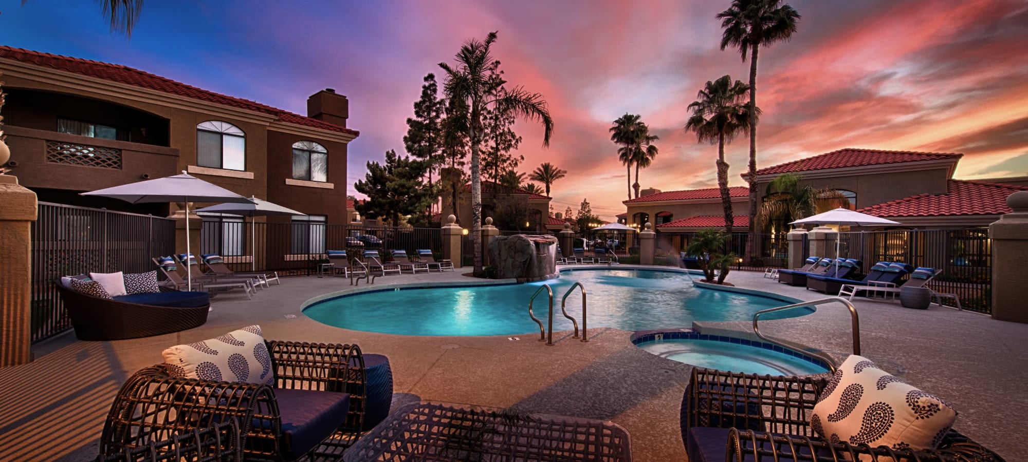 Pool and deck chairs at sunset at The Ventura in Chandler, Arizona