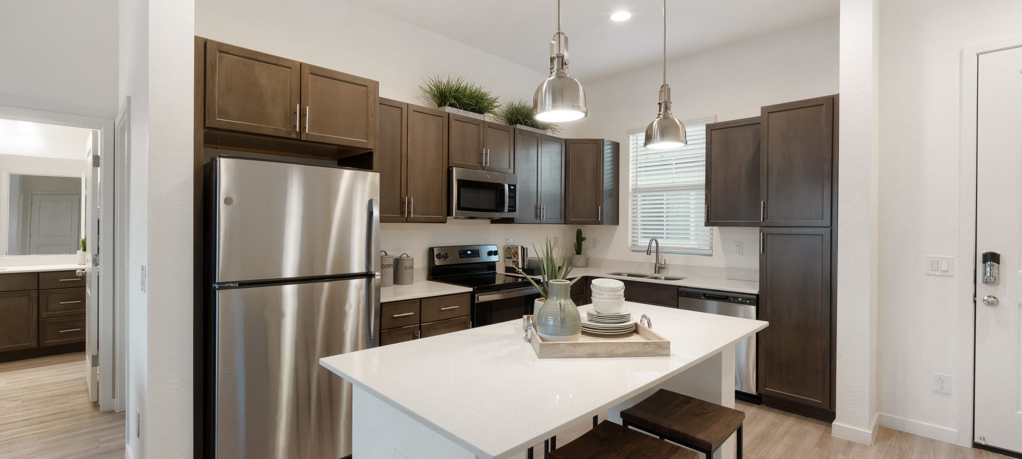 Luxury kitchen with stainless steel appliances at Estia Windrose in Litchfield Park, Arizona