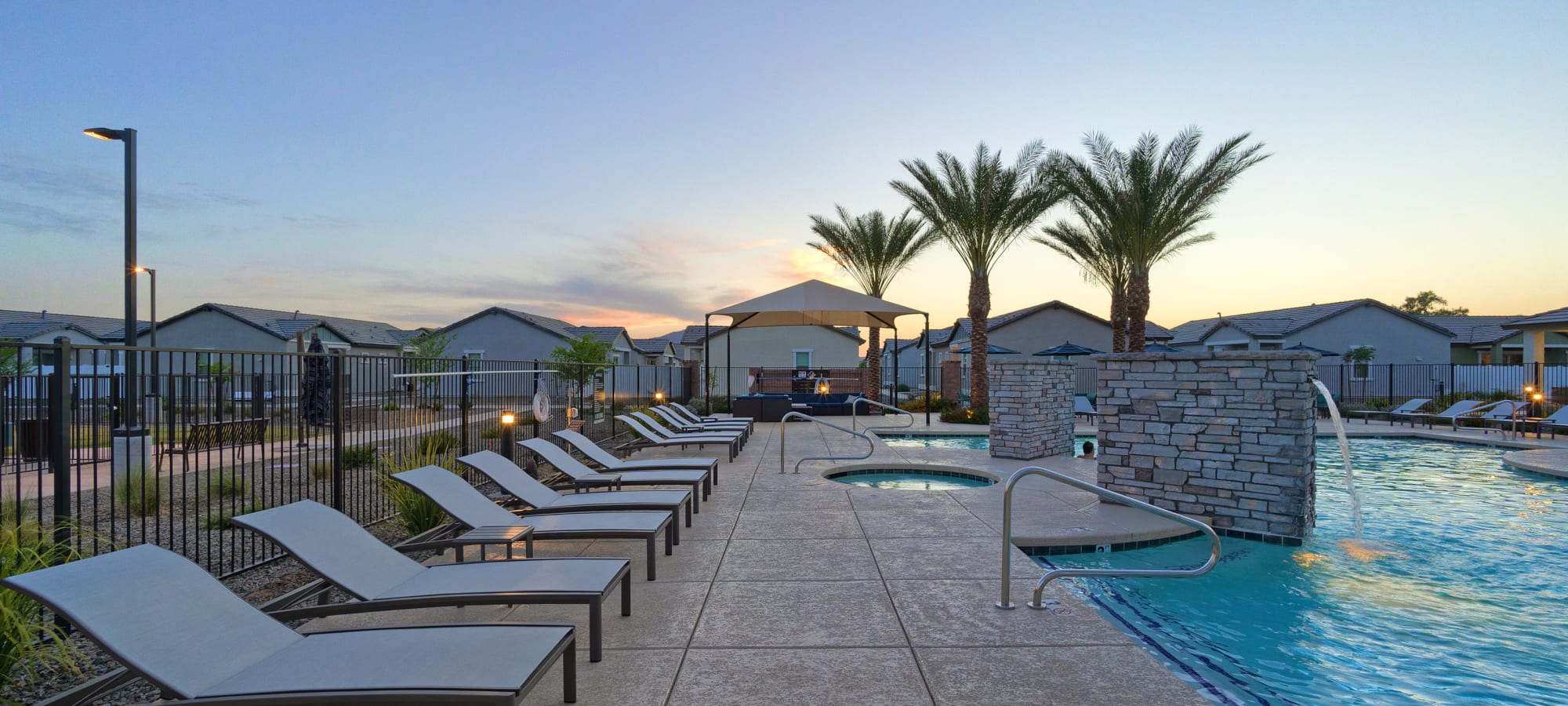 Poolside sunbathing chairs at Estia Windrose in Litchfield Park, Arizona