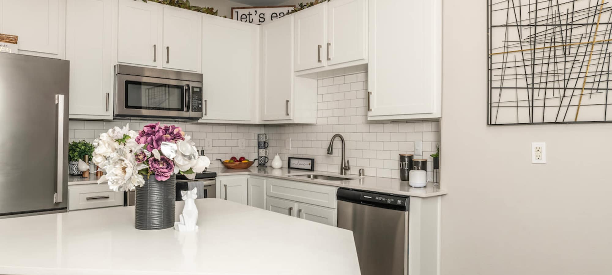 Kitchen Area with White Cabinetry at Cantera at Towne Lake in Cypress, Texas