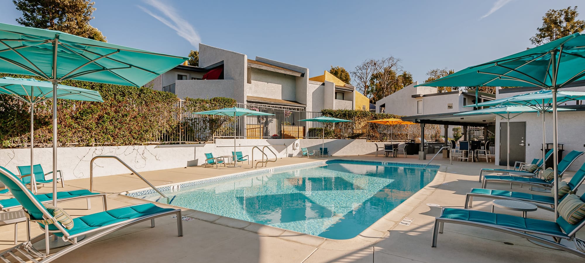 Swimming pool with poolside seating at Reserve at South Coast in Santa Ana, California
