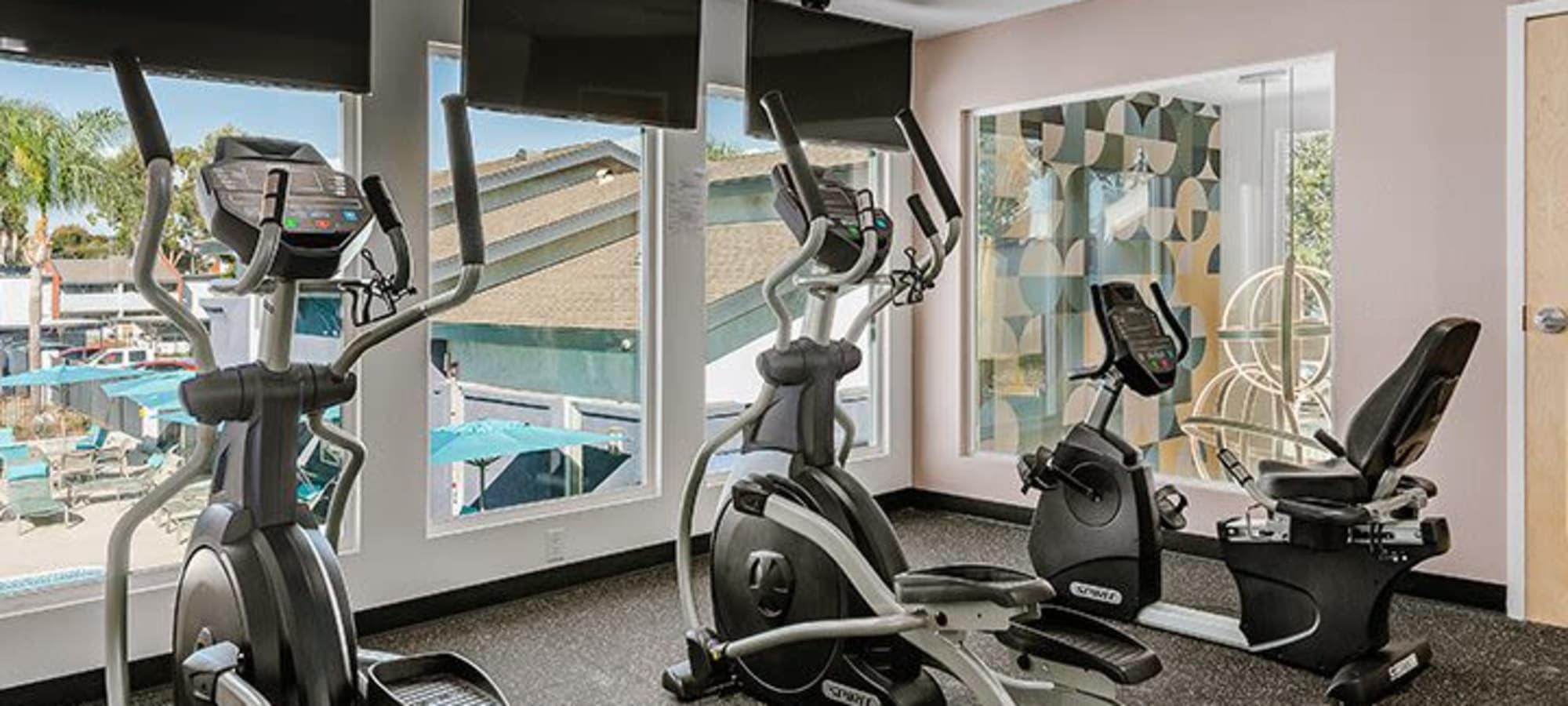 Fitness center with cardio equipment and a view at Reserve at South Coast in Santa Ana, California