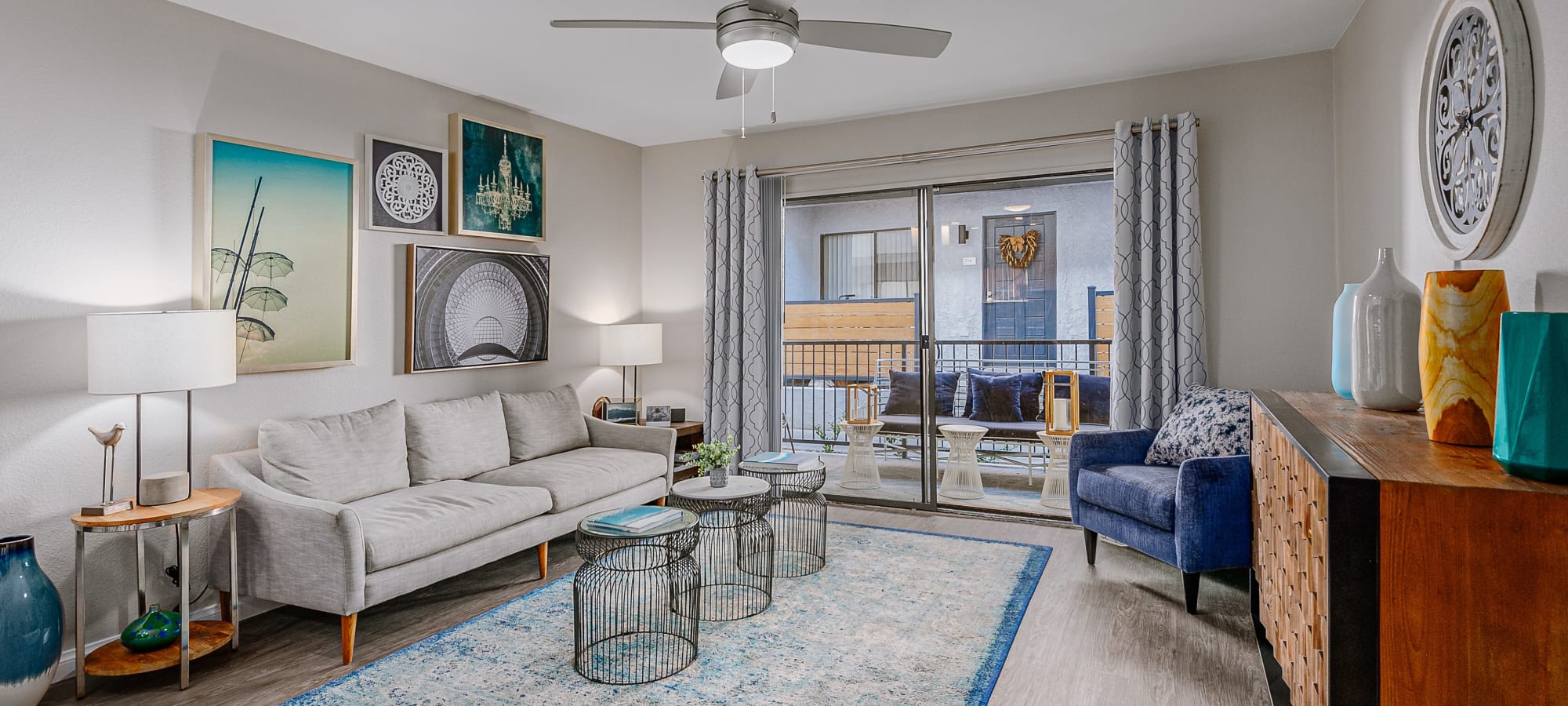 Model living space with balcony at Reserve at South Coast in Santa Ana, California