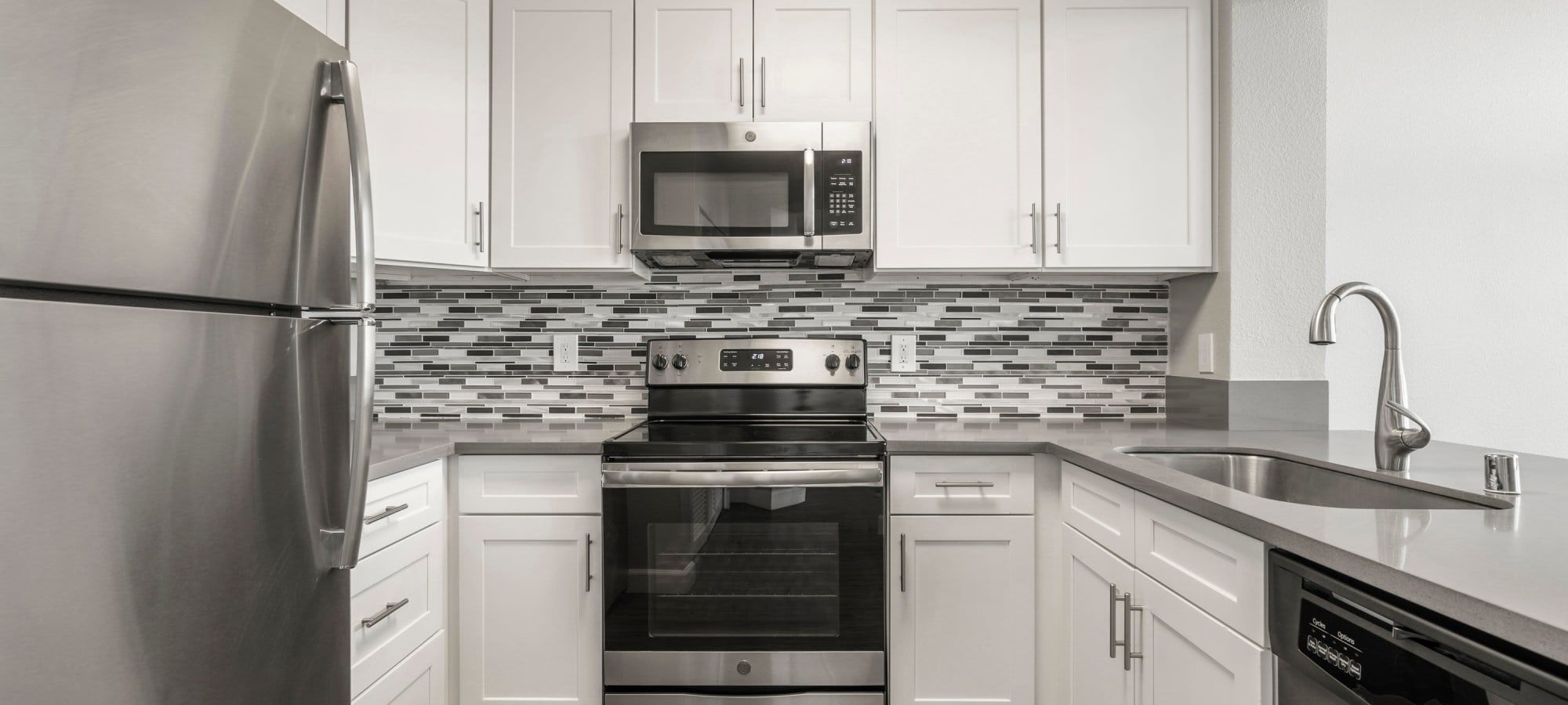 Modern kitchen with gray accents at The Bridge at Emeryville in Emeryville, California