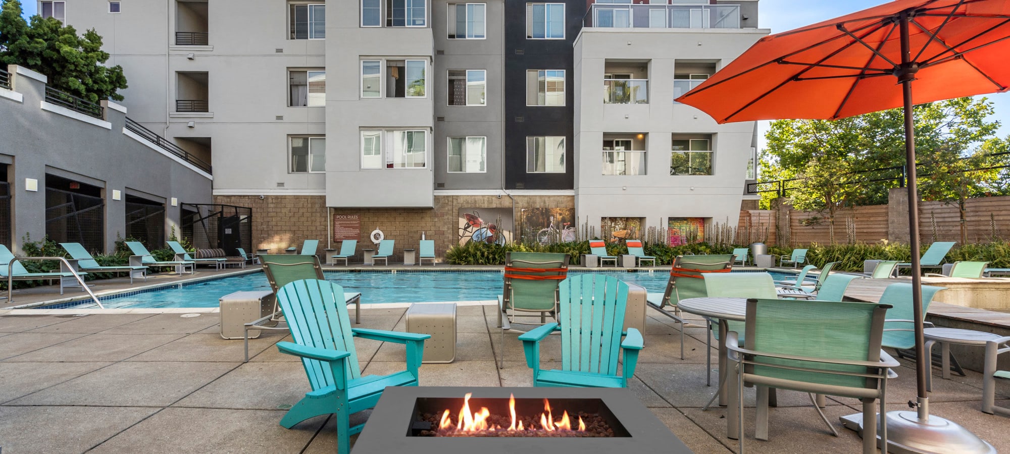 Swimming pool with fireside seating at The Bridge at Emeryville in Emeryville, California