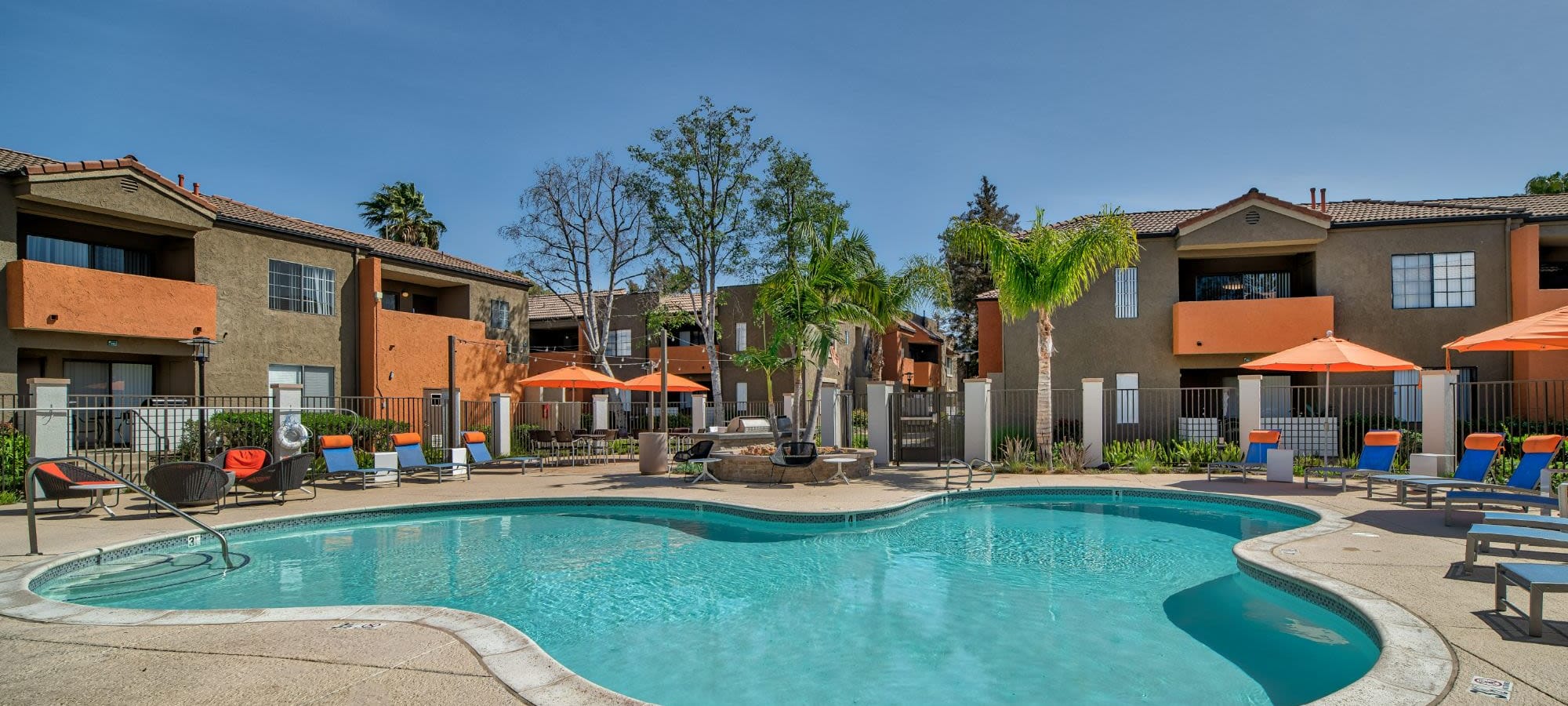 Luxurious pool side patio with sun chairs at The Ranch at Moorpark, Moorpark, California