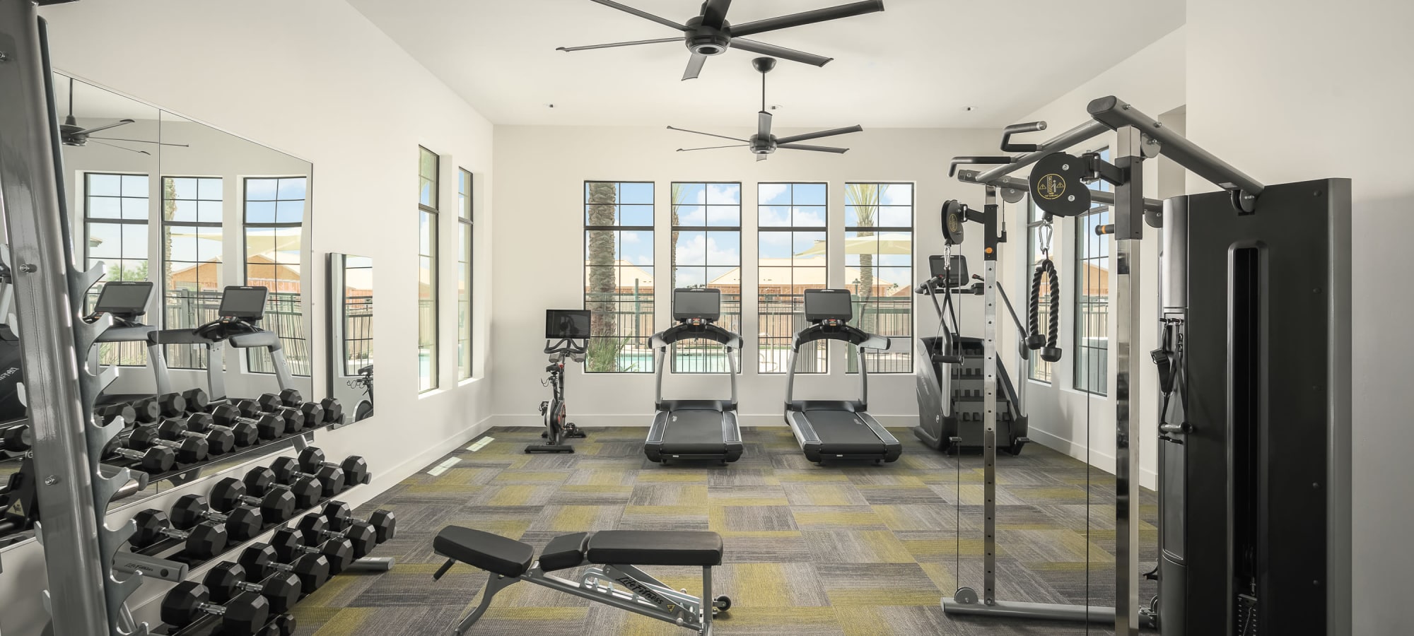 Free weights with cable machines and treadmills at Sobremesa Villas in Surprise, Arizona