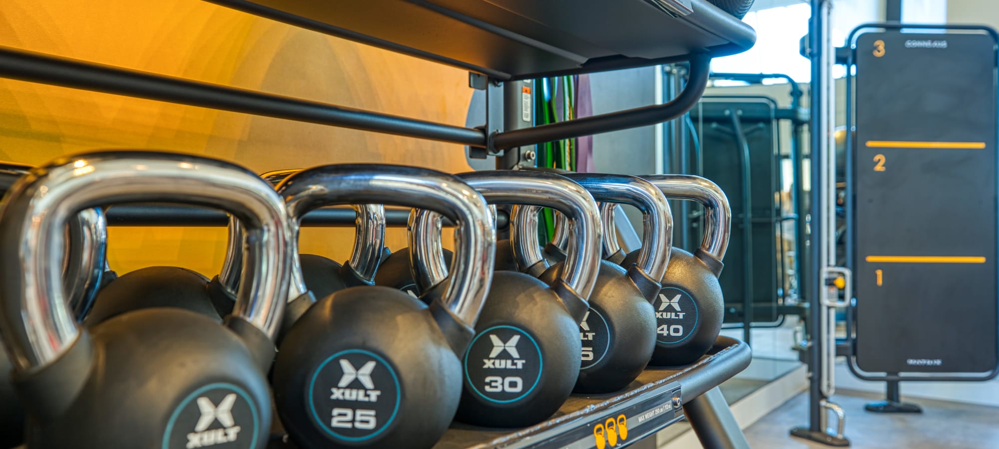 Kettlebell station in fitness center at Alexan Tempe in Tempe, Arizona