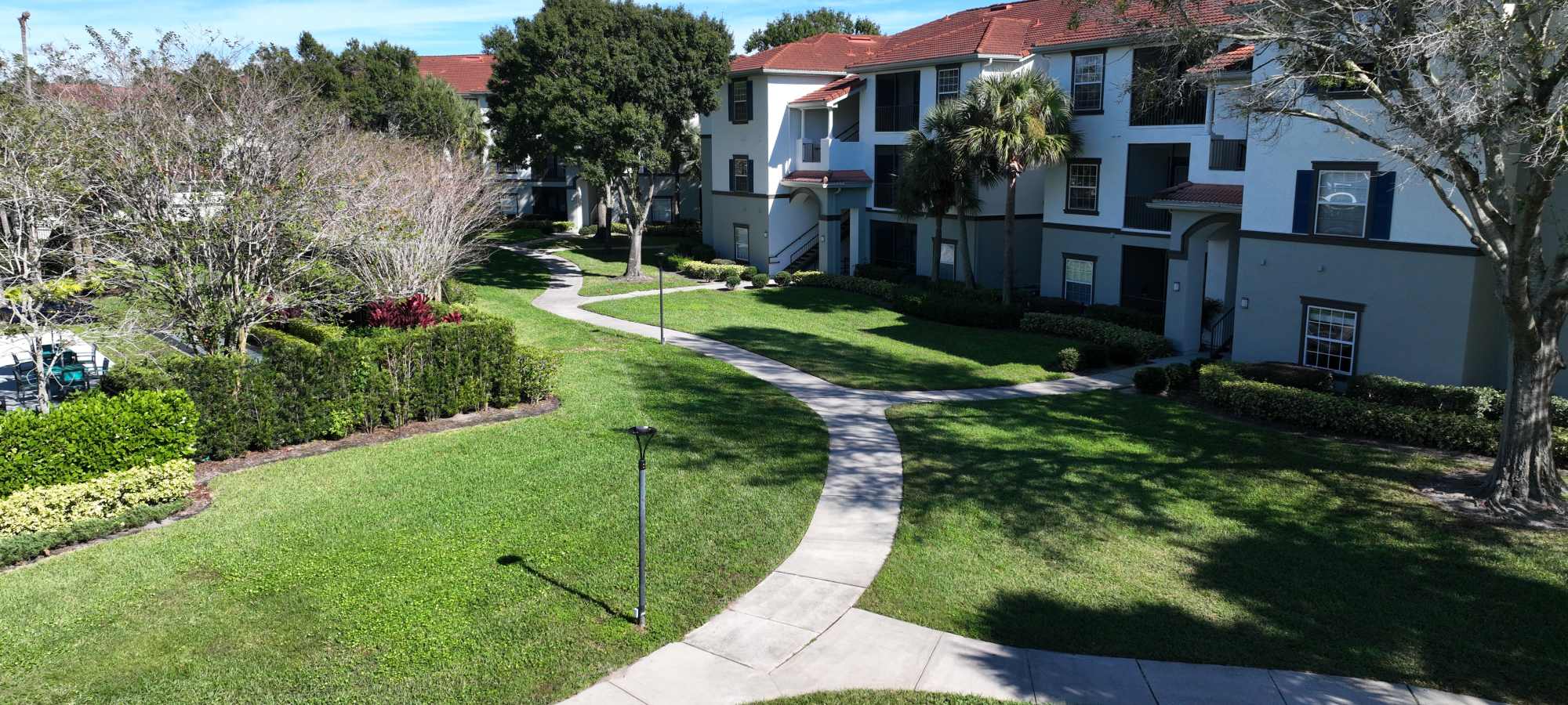 Property walkway at Harbortown Apartments in Orlando, FL
